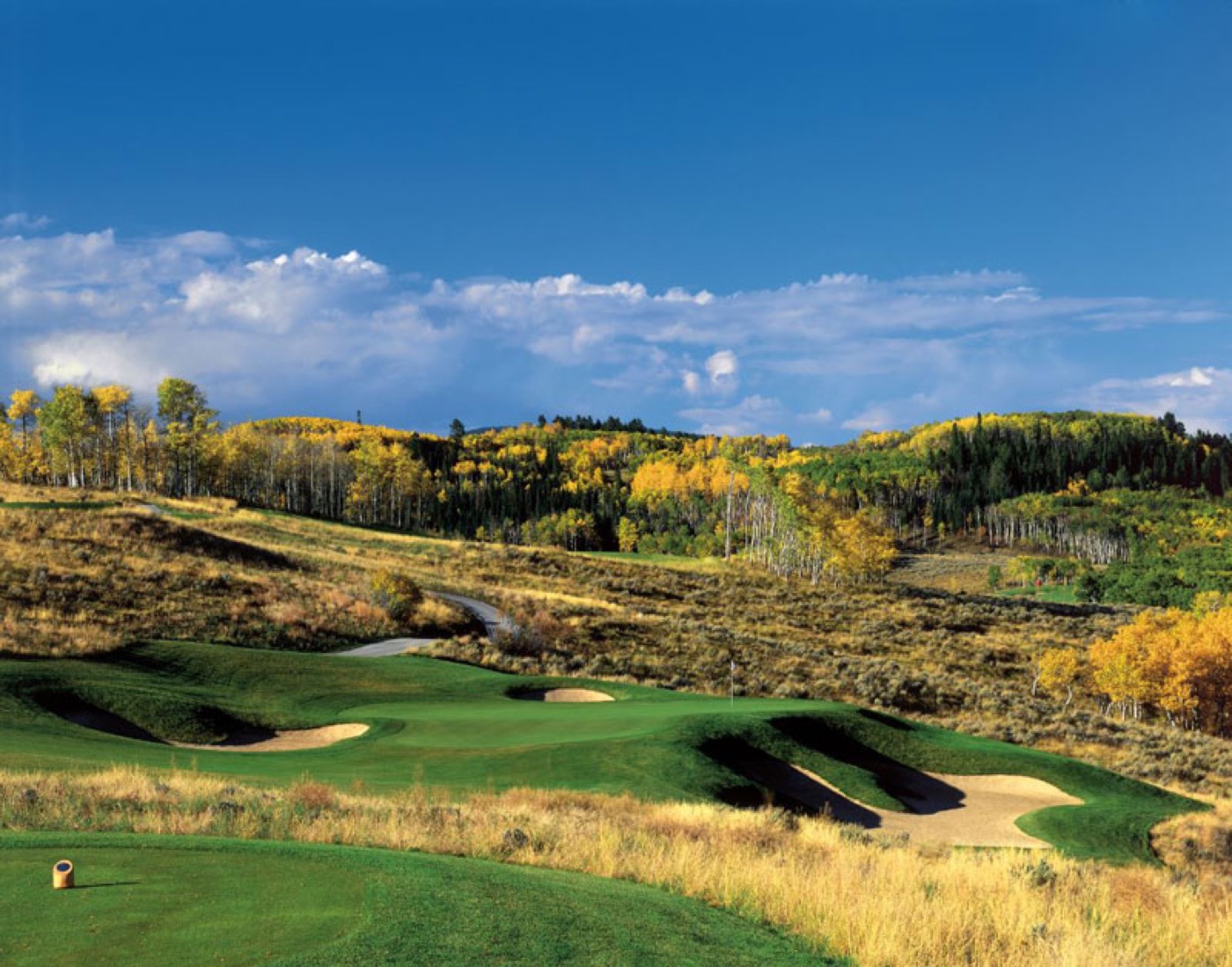 The Summit at Cordillera — mountain course among autumn aspens