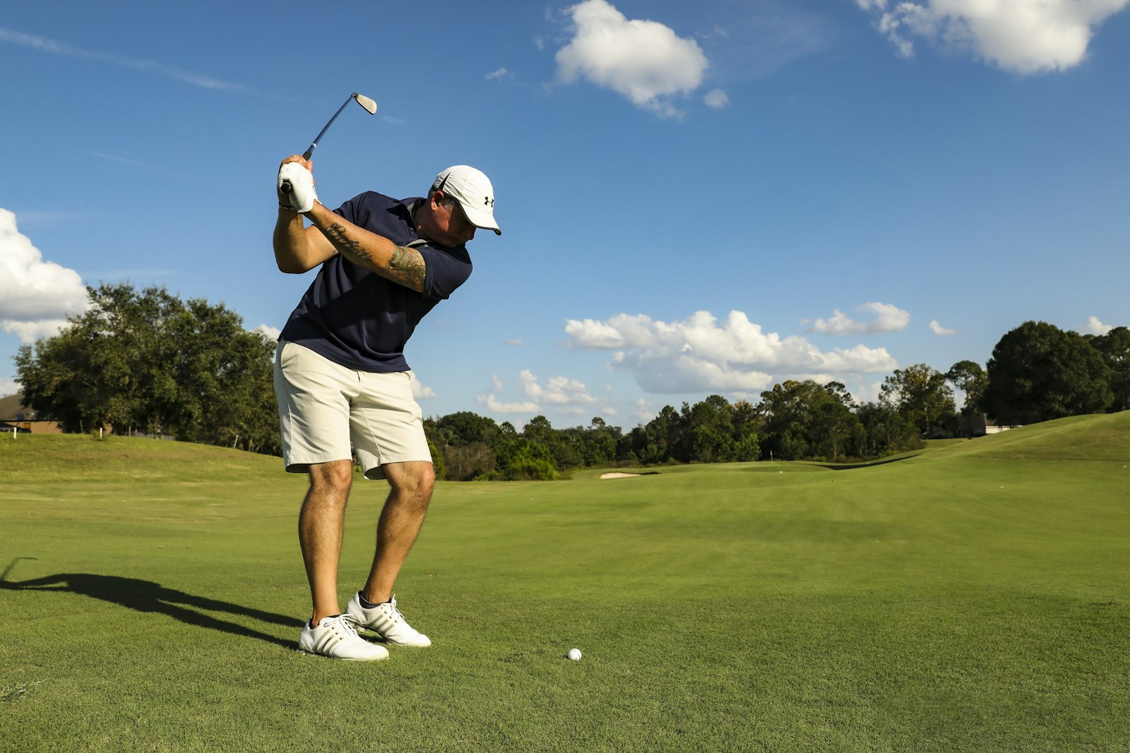 Golfer on a mountain course fairway